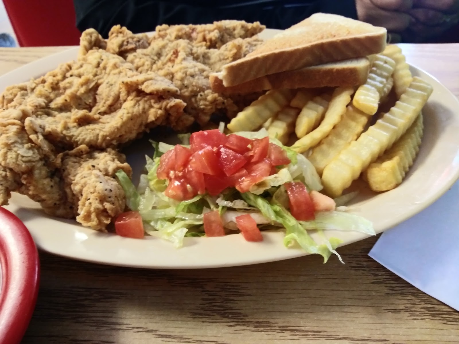 Chicken fried steak plate with fries and toast